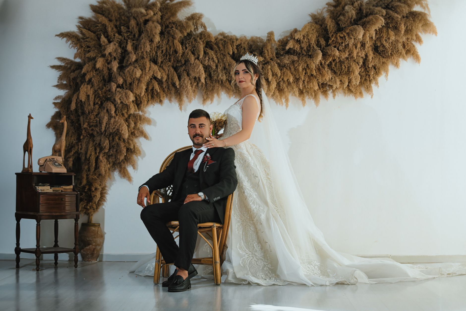 Chic indoor wedding portrait of a couple in Ankara, capturing elegance and style against a rustic backdrop.