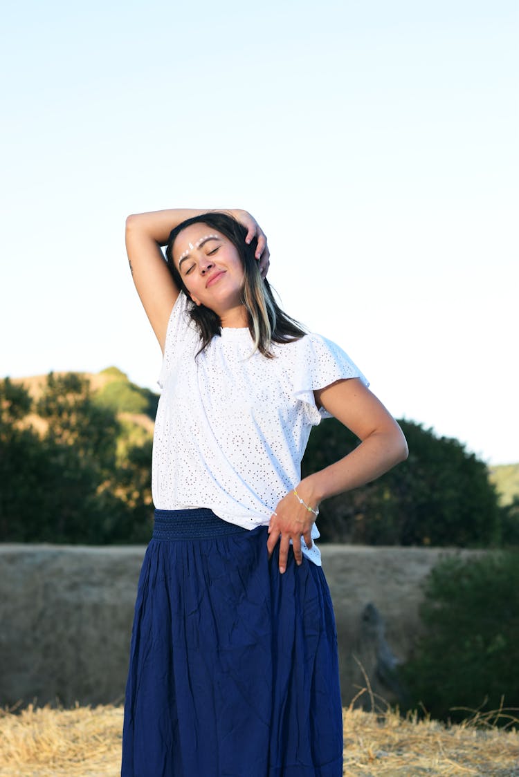 Standing In Blue Skirt Woman With White Dots On Forehead