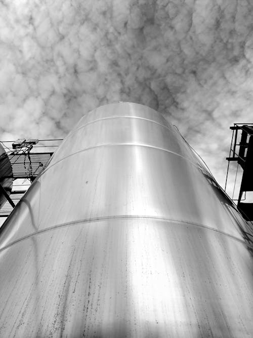 Low Angle Photo of a Shiny Steel Industrial Silos