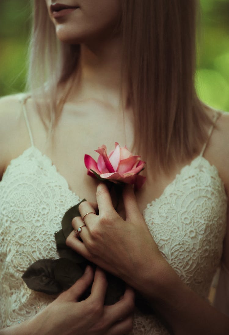 Close Up Of Woman Holding Flower