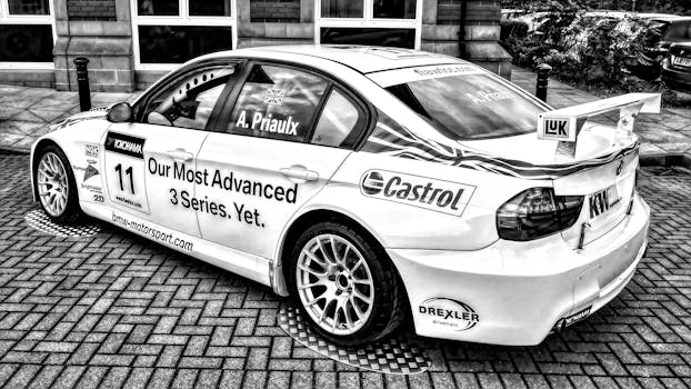 Stylish black and white photo of a high-performance race car on a city street in Burton upon Trent, UK.