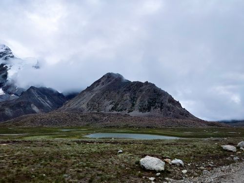 Free Scenic view of a majestic mountain with a cloudy sky in North Sikkim, India. Stock Photo