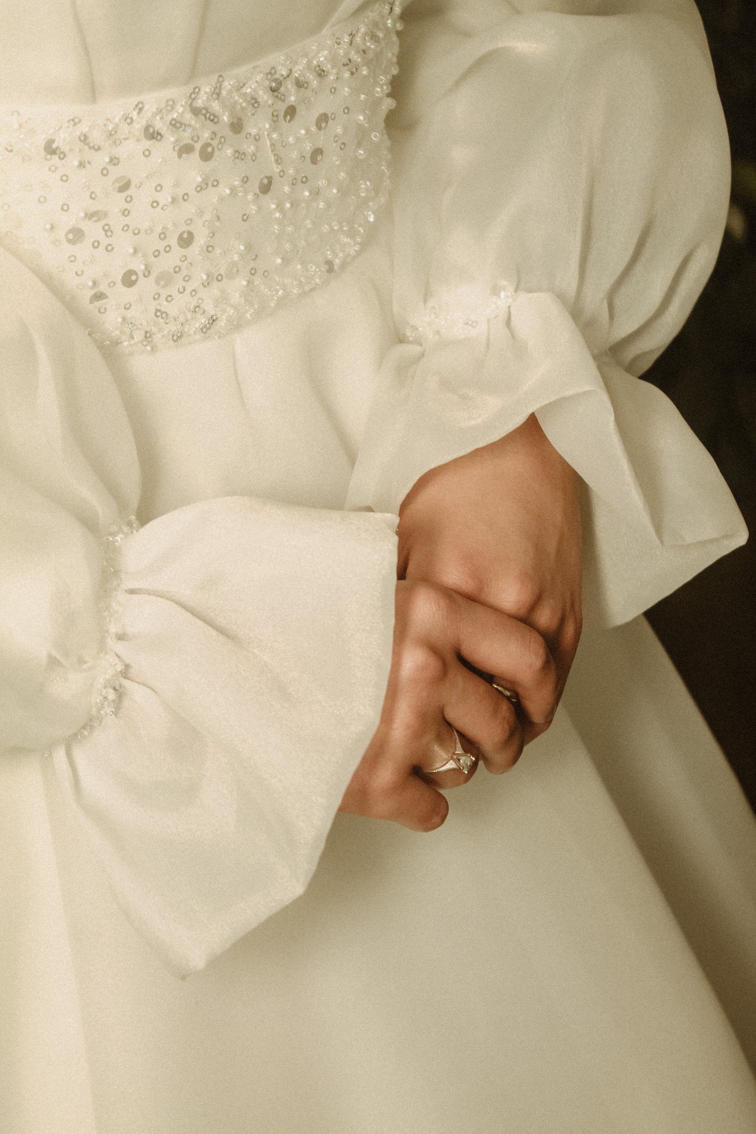 Close detail of an intricately beaded bridal gown