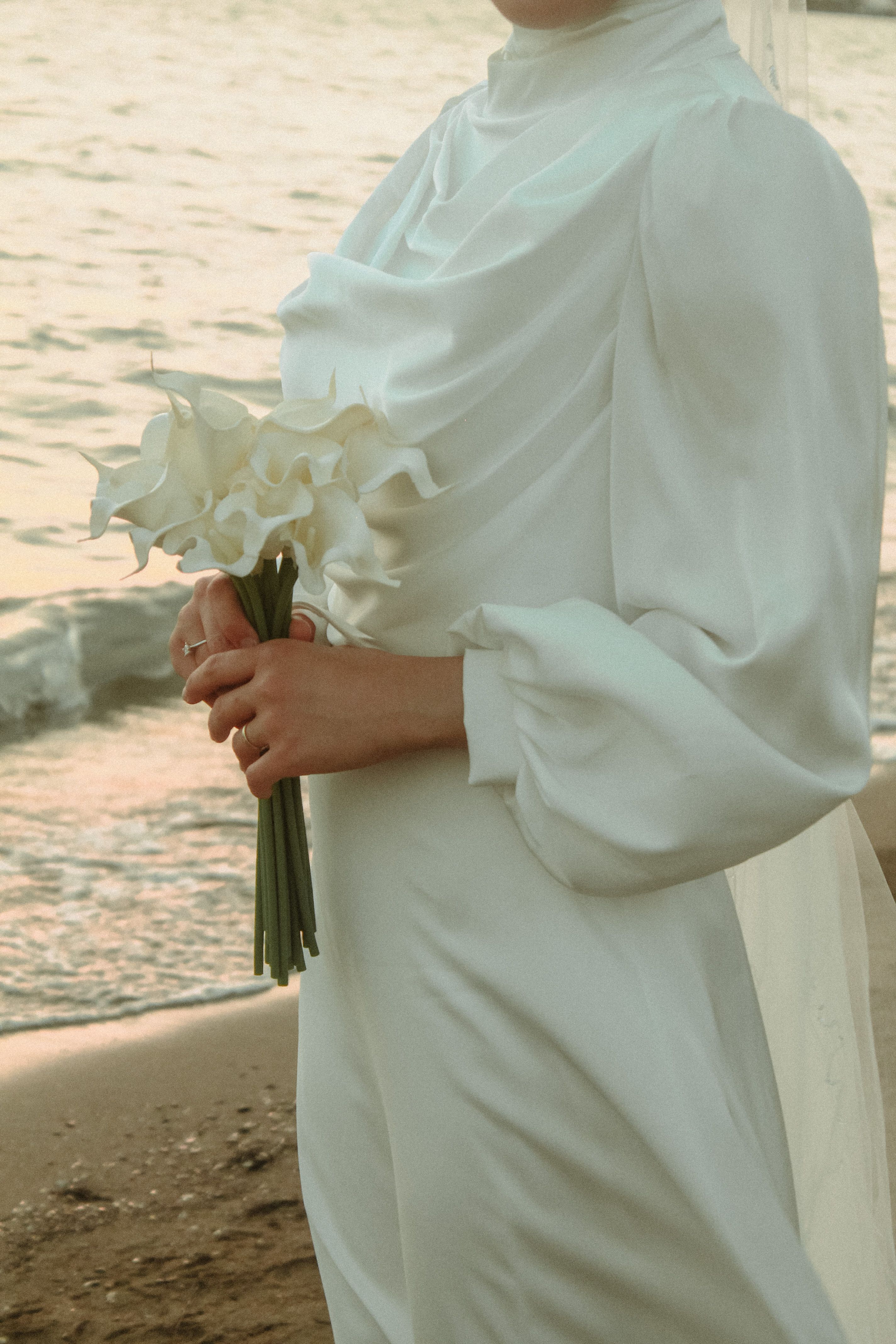 Bride with a Bouquet Standing on the Beach · Free Stock Photo