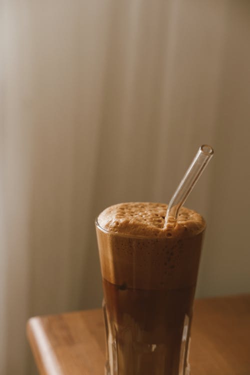 Free Drink in Long Glass with Glass Drinking Straw Stock Photo