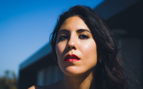 Free Close-up portrait of a woman under blue sky in Fayetteville, Arkansas. Stock Photo