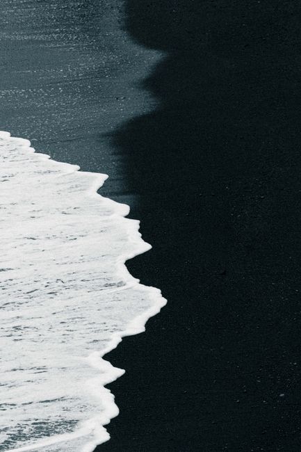 Dramatic waves on a black sand beach in Iceland. Captivating coastal view.