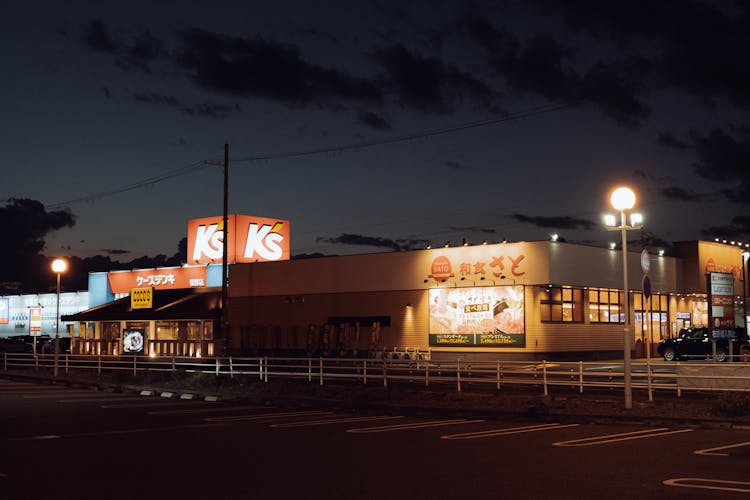 Street By Store In Kyoto, Japan At Night