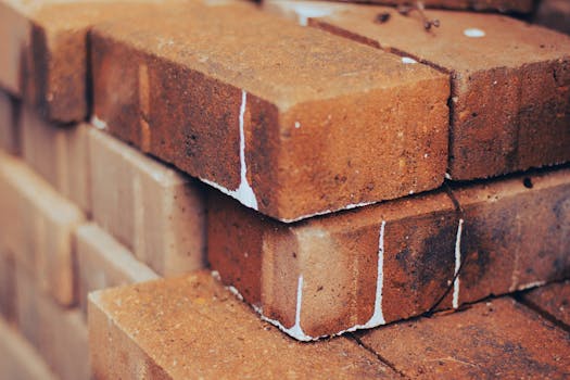 Close-up of stacked red bricks showing texture and detail, ideal for building and construction themes.