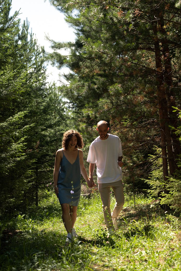 Couple Walking In The Forest