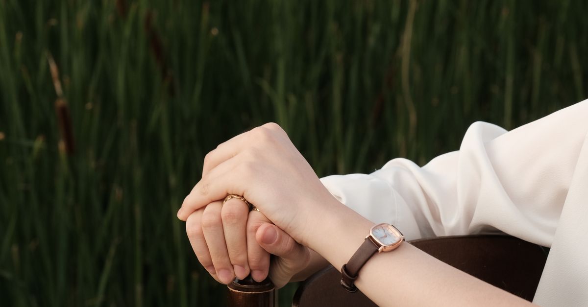 Hands Restting Hands Resting on a Chair in the Nature · Free Stock Photo