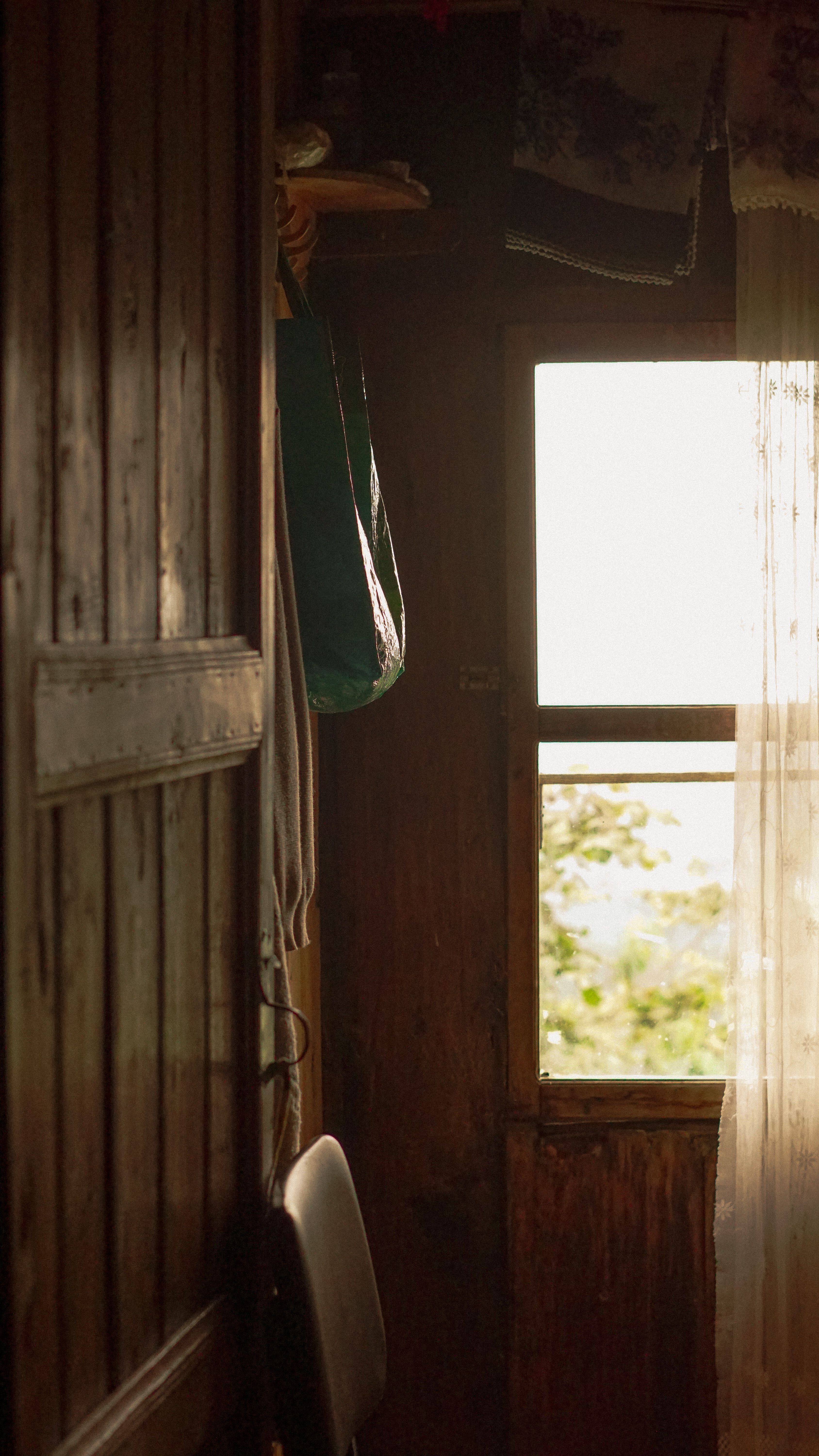 A view of a window in a wooden house · Free Stock Photo