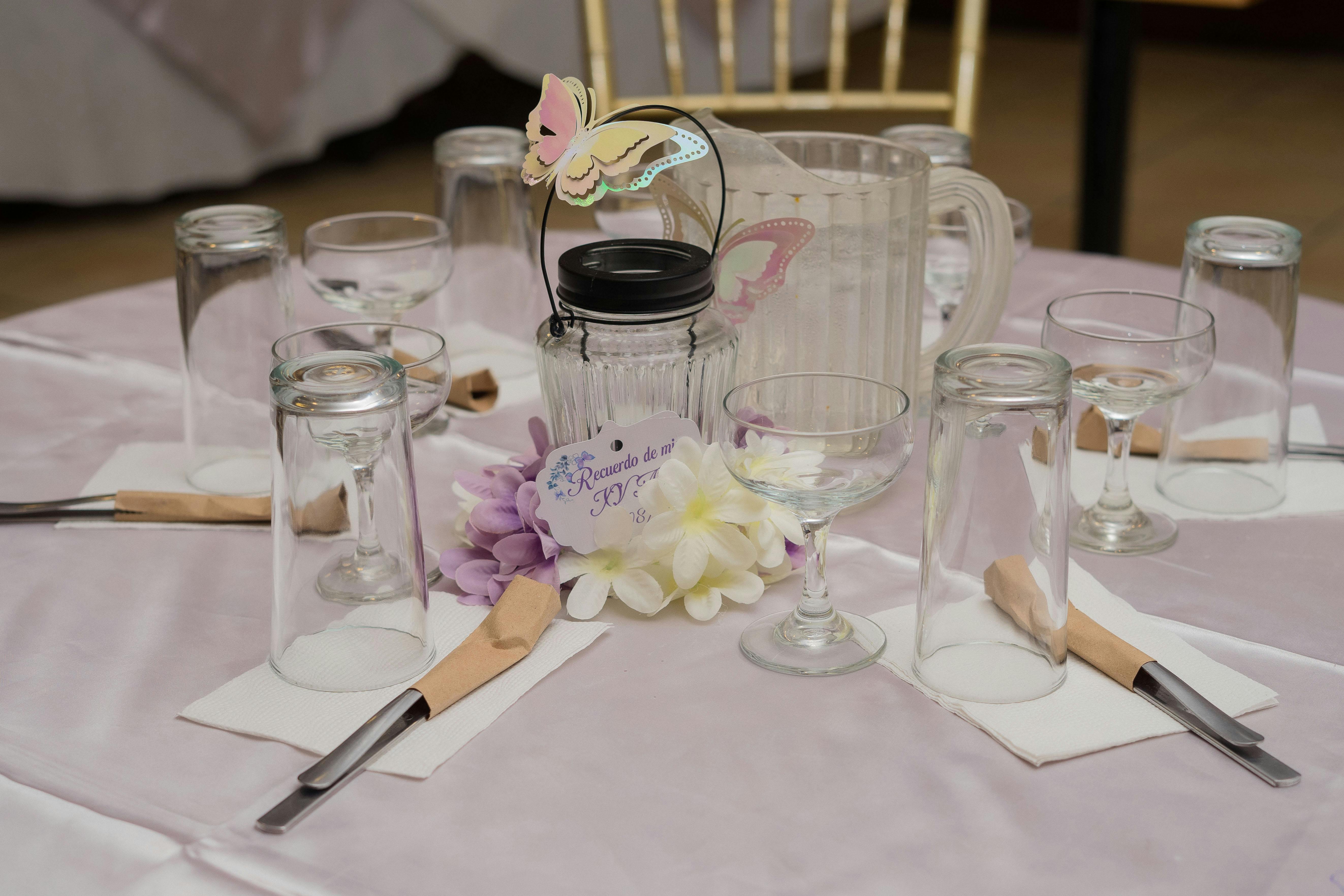 personalised napkin holder - Beautifully arranged dining table with elegant glassware, cutlery, and floral decor for a reception.