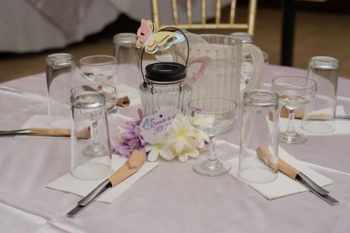 Free Beautifully arranged dining table with elegant glassware, cutlery, and floral decor for a reception. Stock Photo