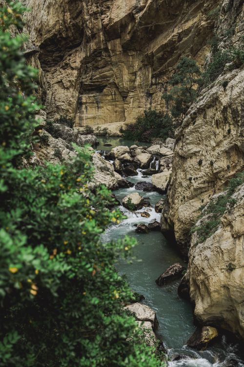 Free Stunning river cutting through Ardales Gorge, perfect for nature lovers and adventurers. Stock Photo