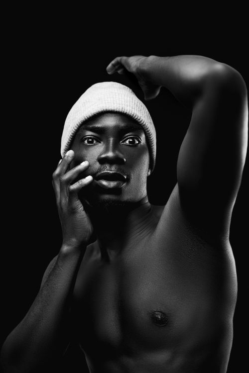 Free Elegant black and white studio portrait of a shirtless man posing. Stock Photo