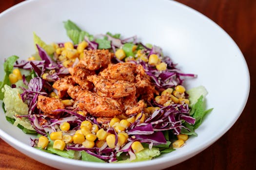 Delicious chicken salad with corn and cabbage, perfect for a fresh meal.