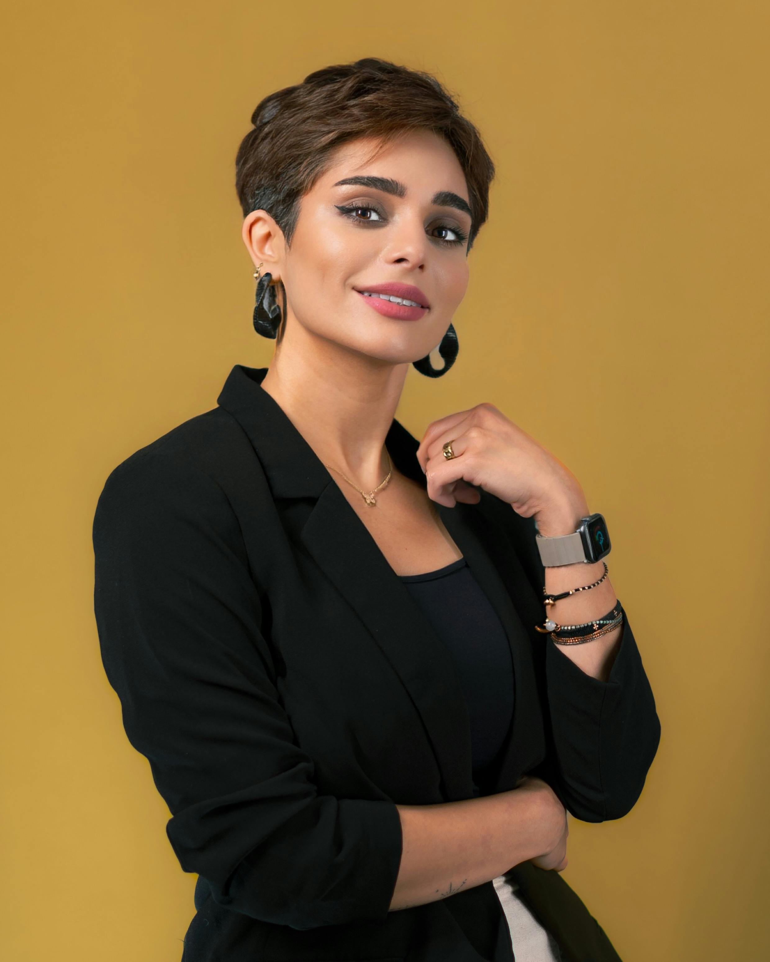 Elegant portrait of a businesswoman in a black blazer, conveying confidence and professionalism.