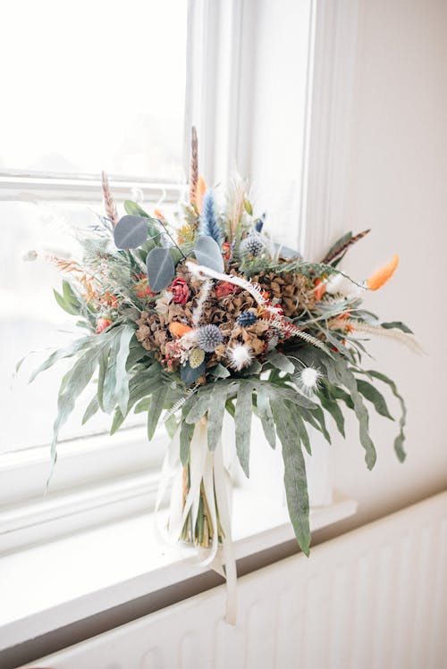 Lovely Bouquet of Flowers in Vase on Windowsill