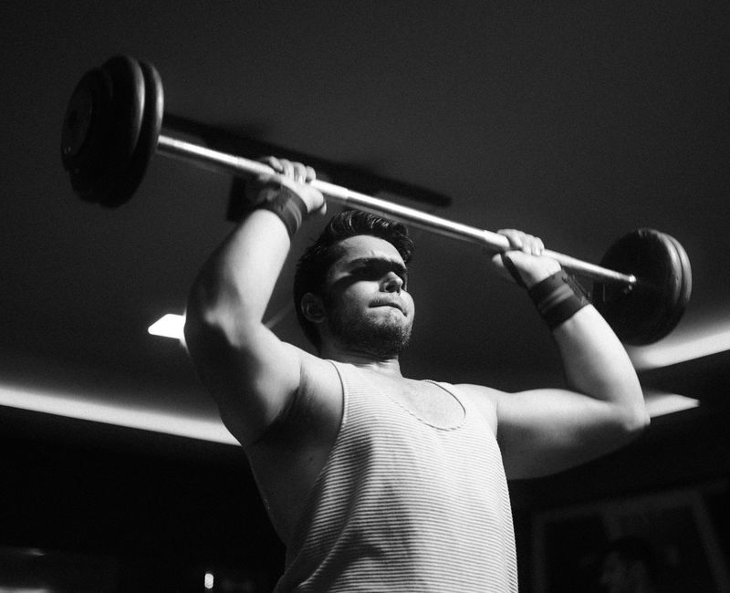 A person lifting weights in a gym