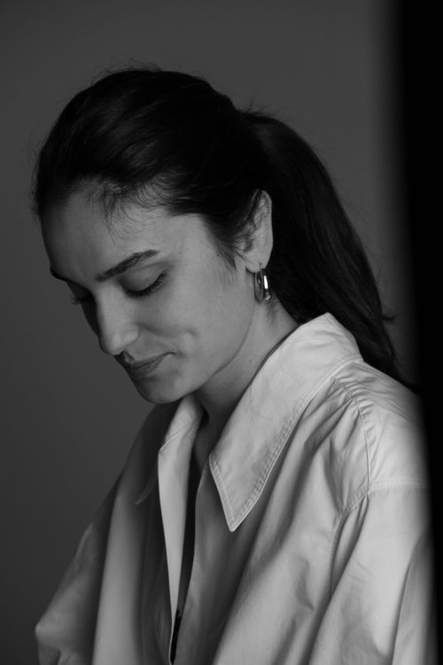 Free Captivating black and white portrait of a woman in contemplative pose. Stock Photo