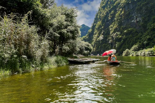 Fotos de stock gratuitas de canoa, gente, montañas