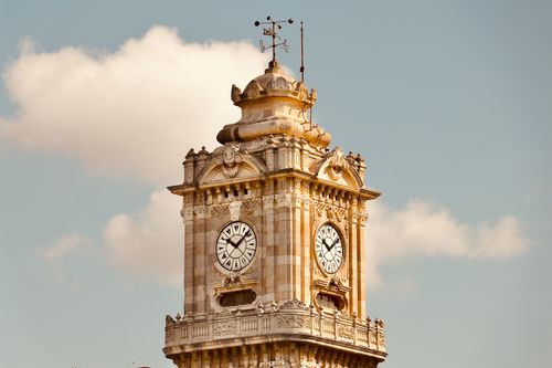 Free Close-up of the historic Dolmabahce Clock Tower under a clear sky in Istanbul. Stock Photo