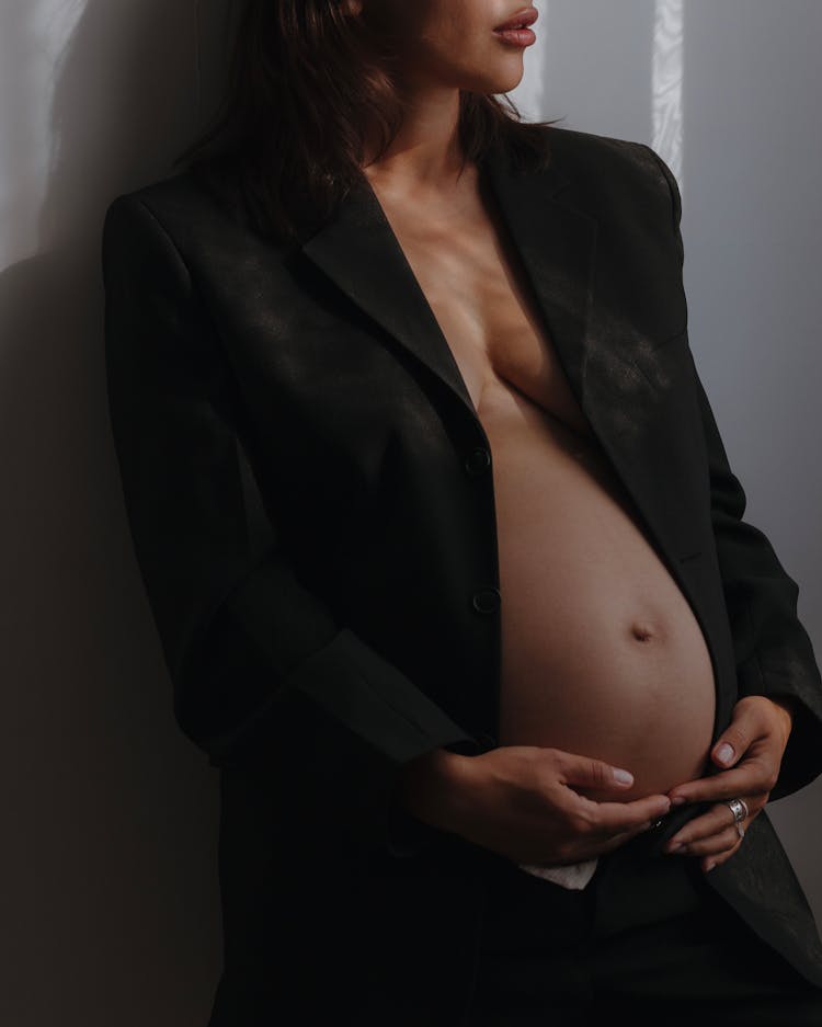 Elegant Pregnant Woman Posing At A Pregnancy Photoshoot 