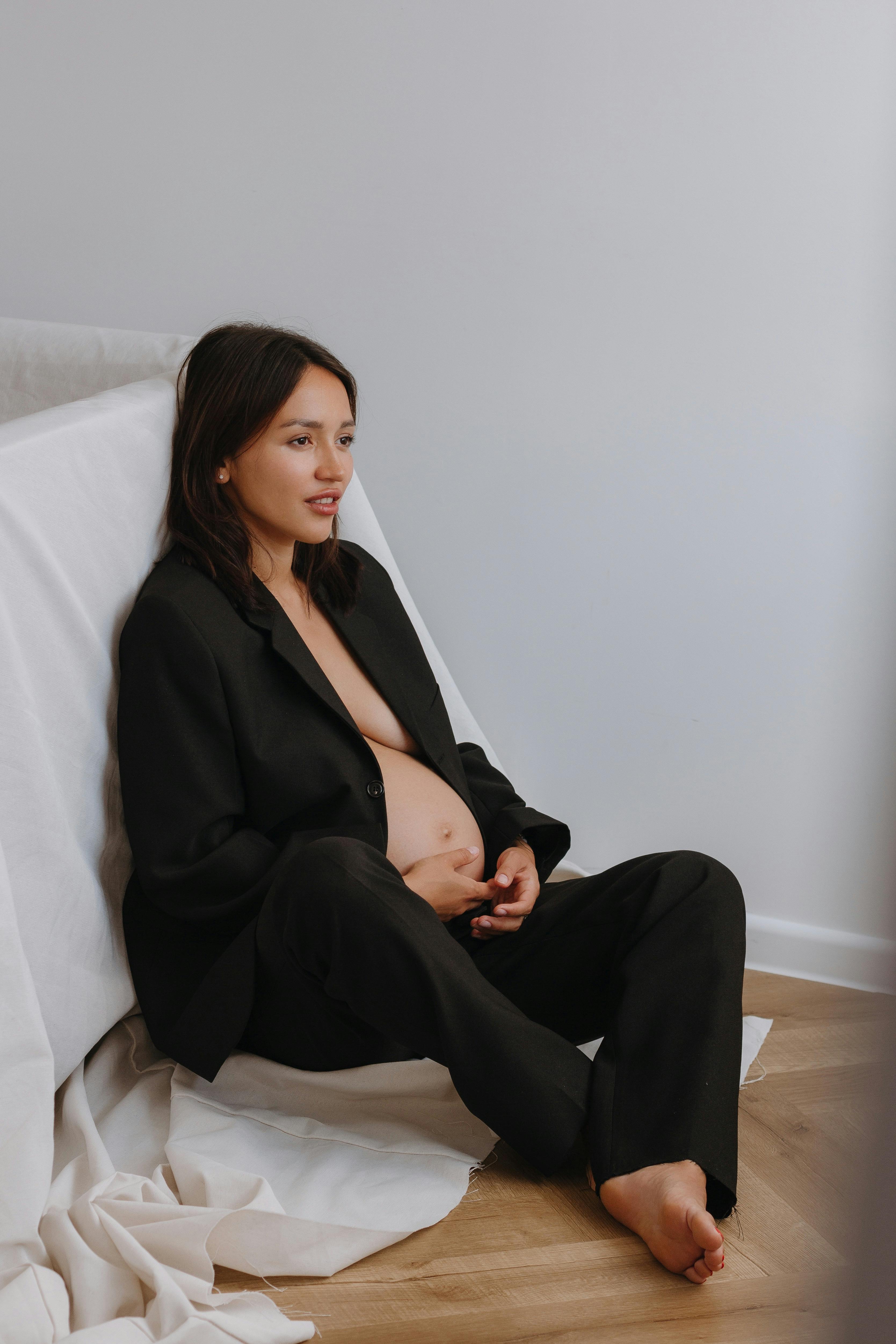 elegant pregnant woman posing at a pregnancy photoshoot