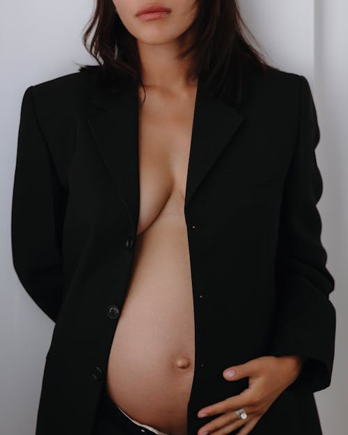 Young Pregnant Woman Posing in Black Blazer
