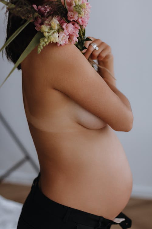 A Pregnant Topless Woman