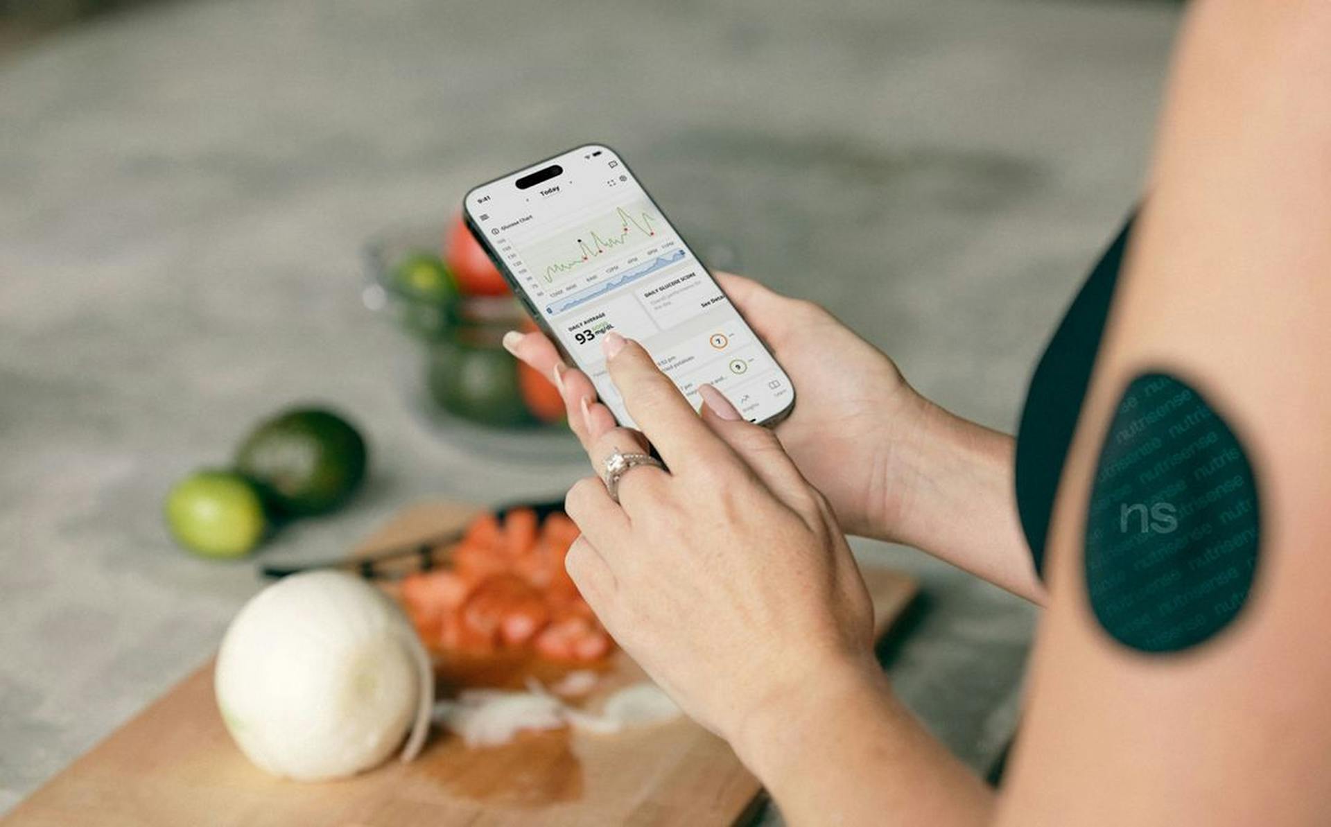 Woman Measuring Blood Sugar level with a Smart Phone App