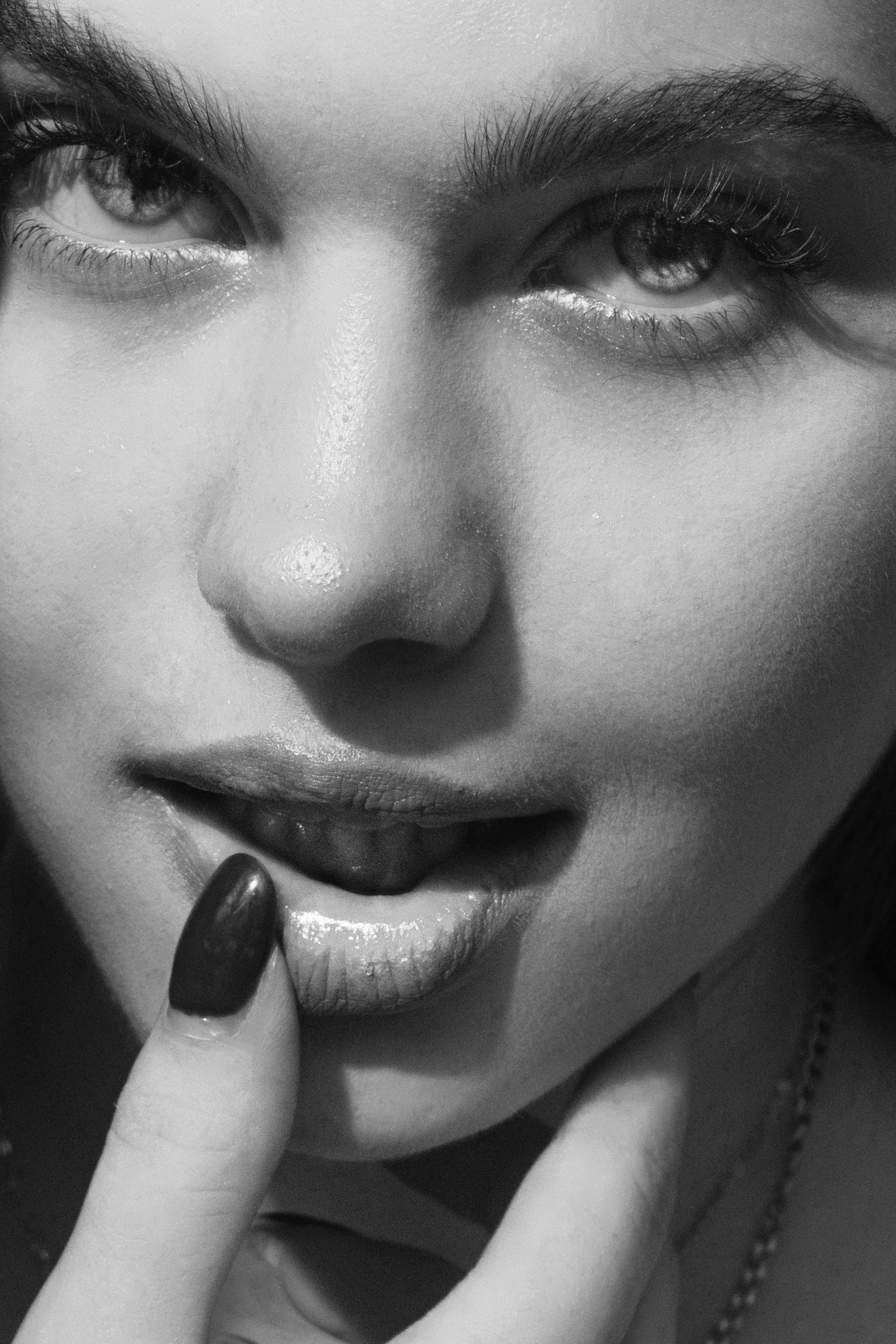 Black and White Photo of a Woman Touching her Lips · Free Stock Photo