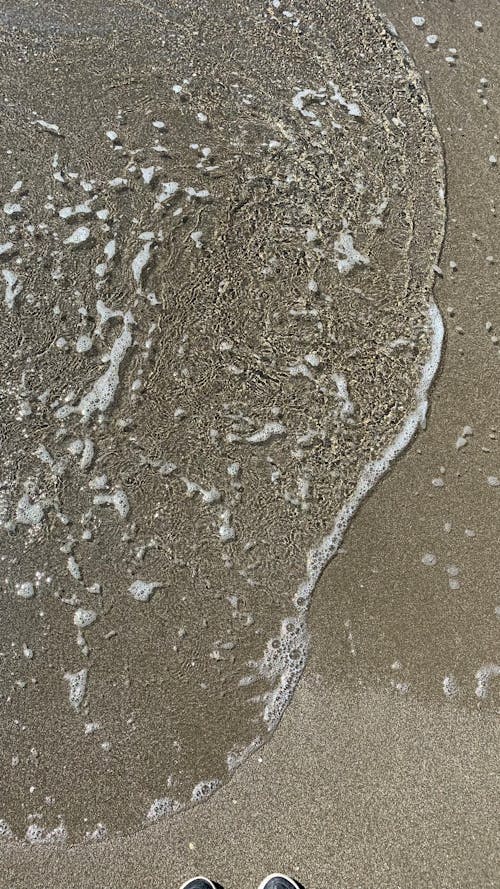 Free Wave on the Sand Stock Photo