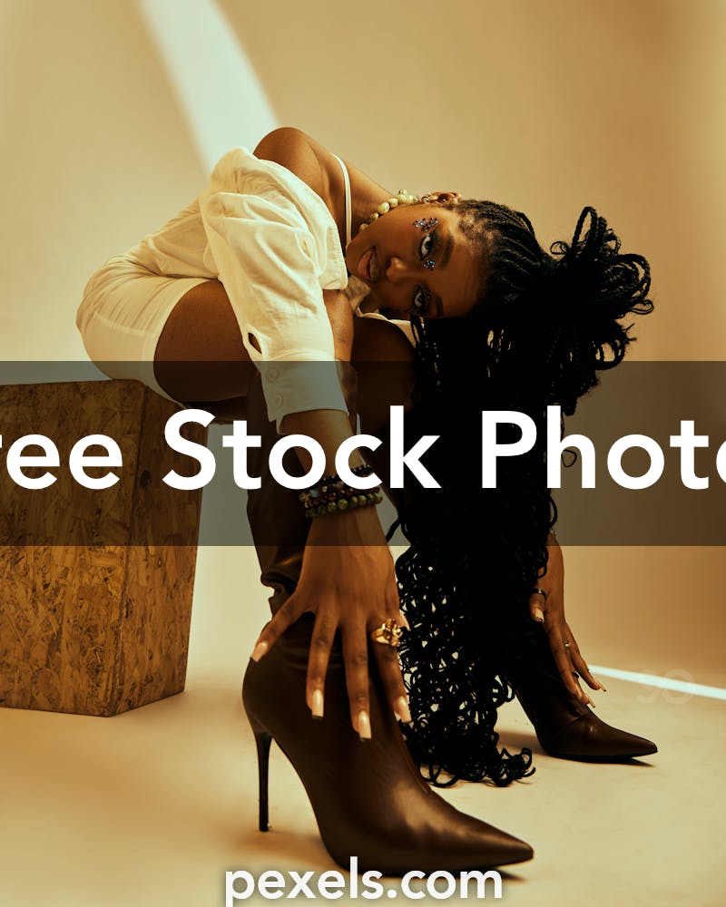 Young Woman Wearing High Heeled Boots and Posing in Studio · Free Stock  Photo