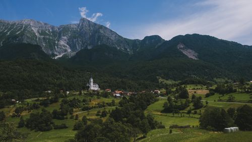 Free Picturesque view of a chapel in Dreznica, Slovenia surrounded by lush mountains. Stock Photo