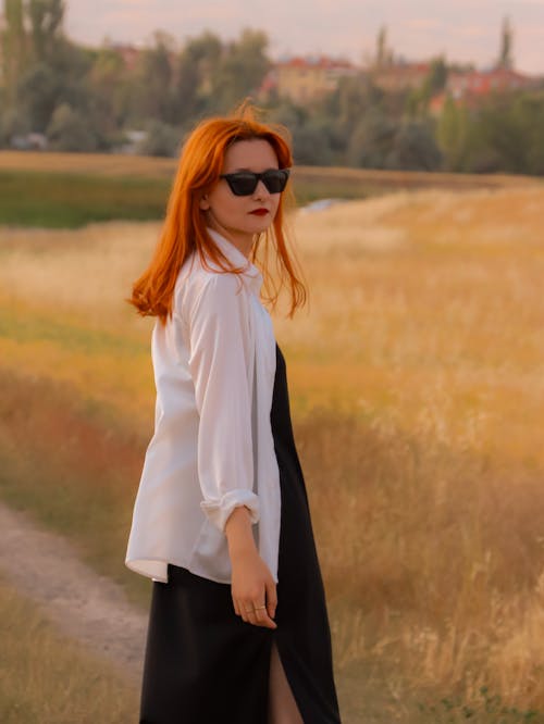 Redhead Model Wearing Dress and White Blouse 