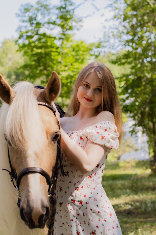 Woman in Sundress Standing with Horse