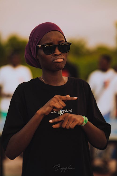 Woman in T-shirt, Shawl and Sunglasses