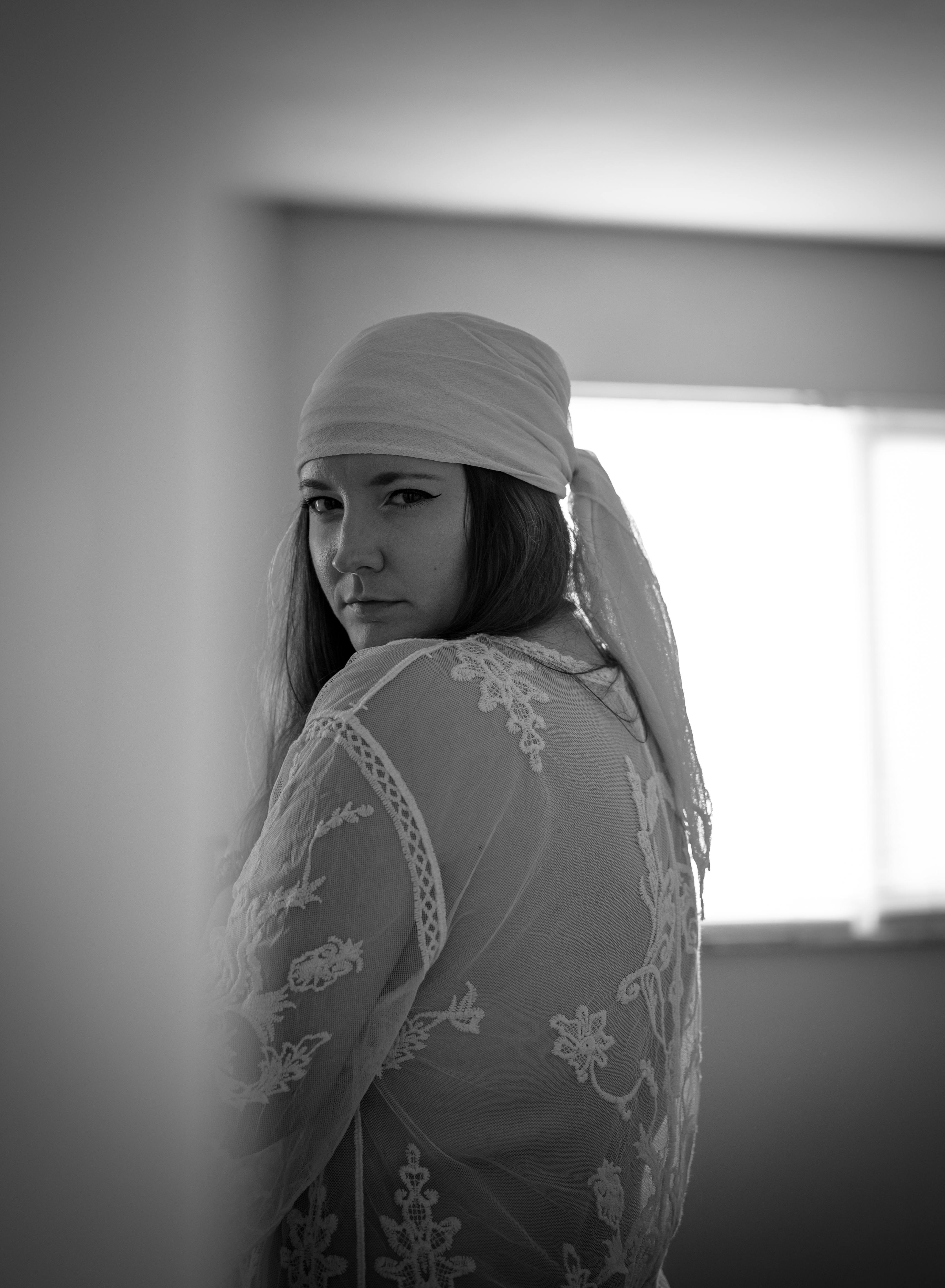 Woman in a blouse and a headscarf free stock photo