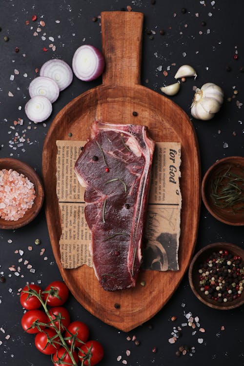 A Steak on a Wooden Cutting Board 