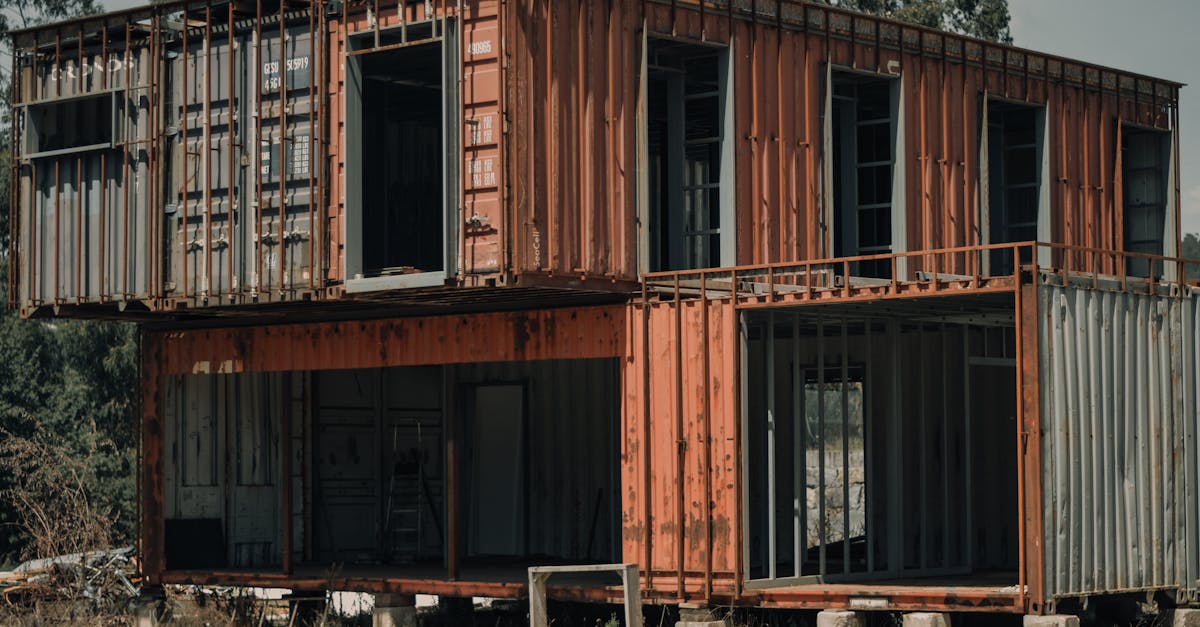 An old, repurposed shipping container building located in a rural area near Paços de Ferreira, Portugal.