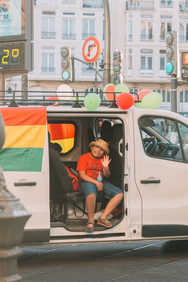 Boy Waving From Van