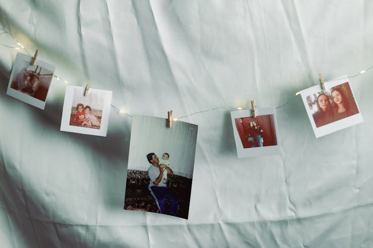 Family Photos Hung On String Lights