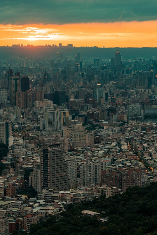 Free Aerial View of a Modern City at Sunset  Stock Photo