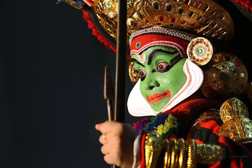 Man Wearing Traditional Asian Stage Makeup and Costume 