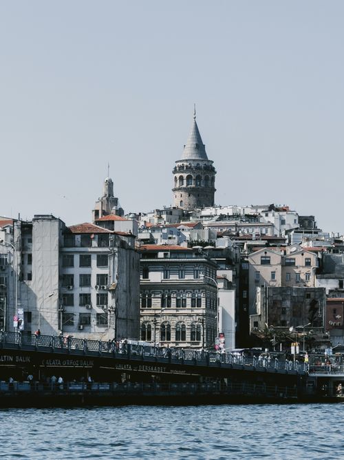 Free View of the historic Galata Tower amidst Istanbul's skyline seen from the waterfront. Stock Photo