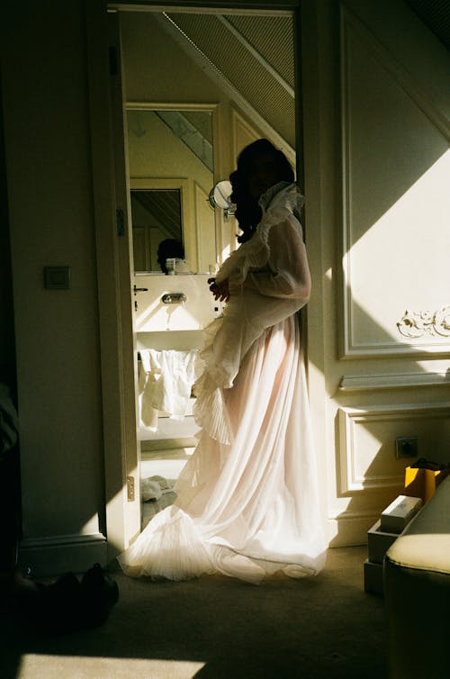 Bride in Wedding Dress Standing in Doorway