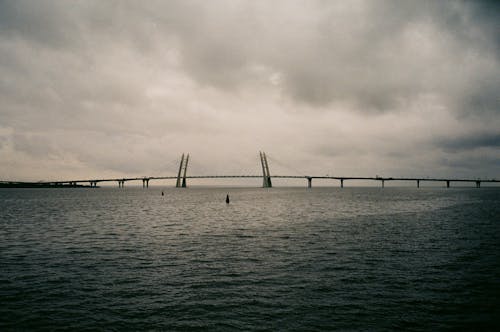 Clouds over Bridge on Sea Coast