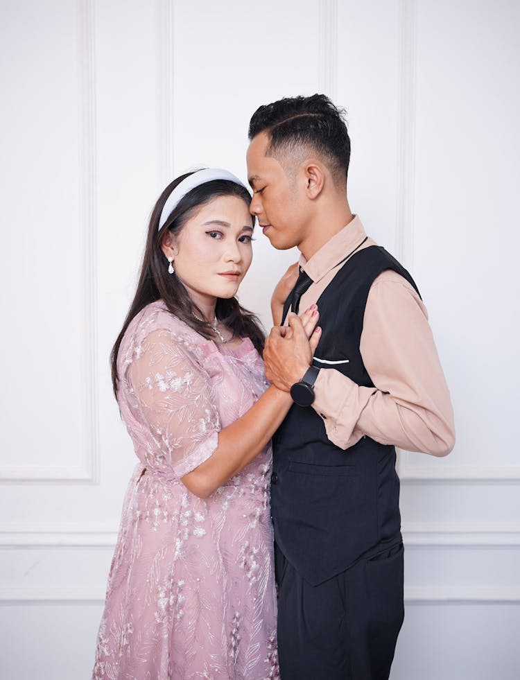 Woman In Dress And Man In Shirt With Vest